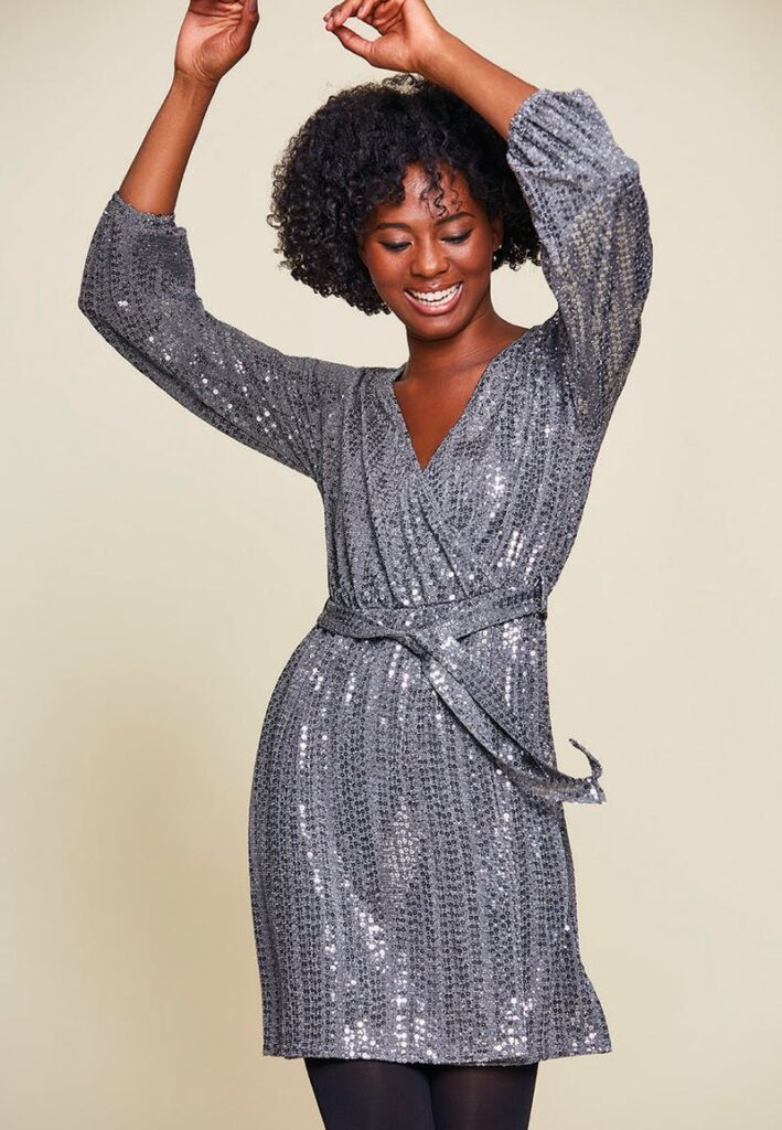 Shine bright in this gorgeous sequin wrap dress.