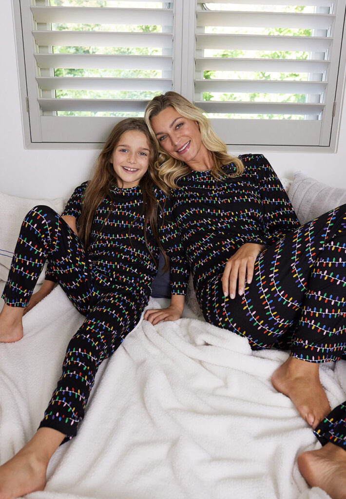 Snuggle up this season with matching family pyjamas in this cute Xmas lights print.